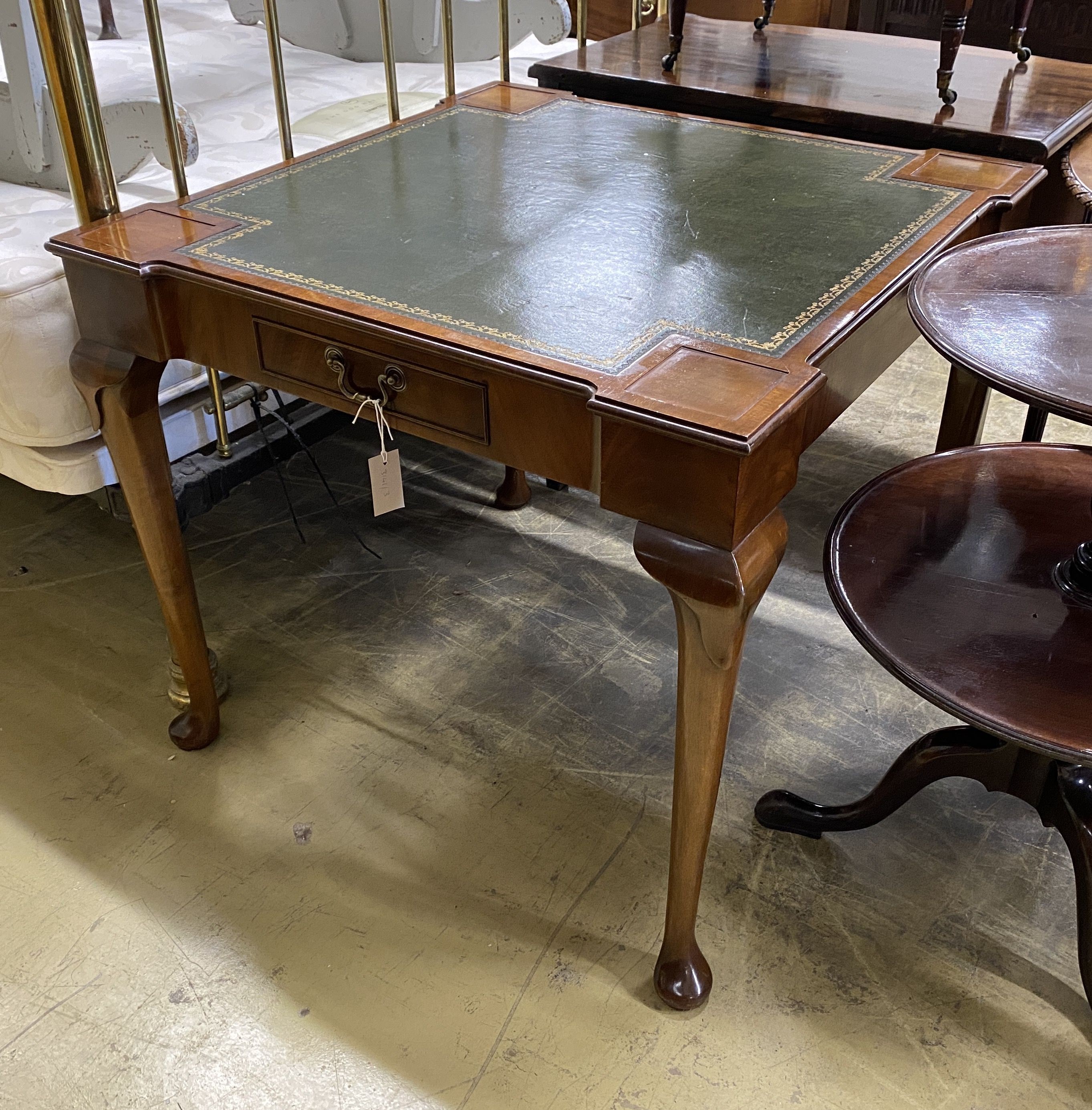 A reproduction George II style square mahogany card table with inset leather top, width 85cm, height 75cm